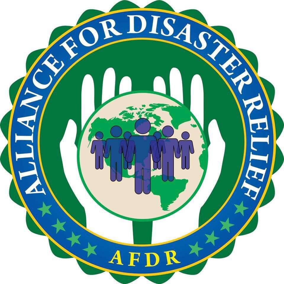 A green and blue logo with people holding hands.